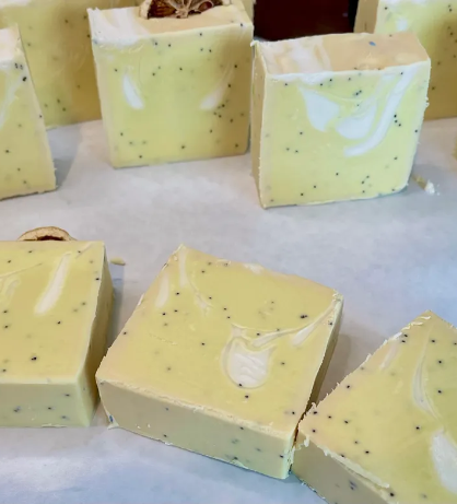 A group of yellow soaps sitting on top of a table.