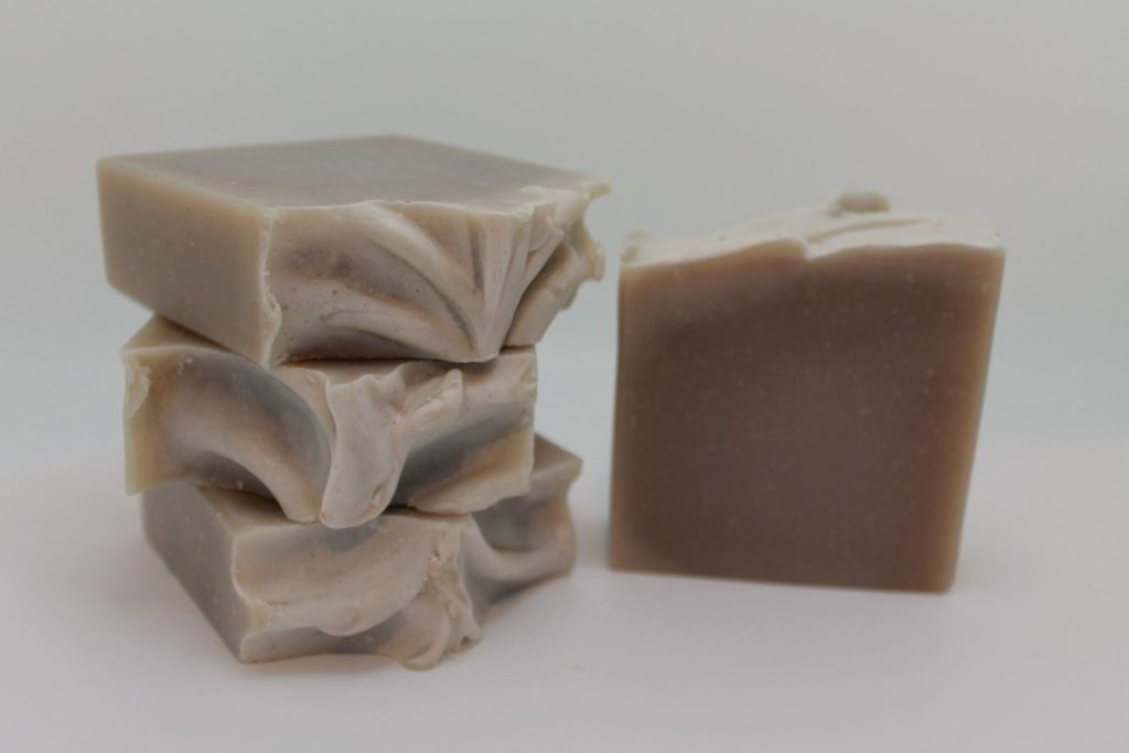 A stack of three soap bars next to each other.