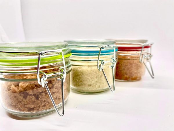 A group of jars filled with different types of food.