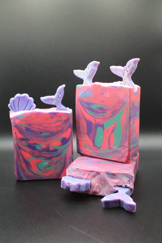 A couple of soap that are sitting on the table