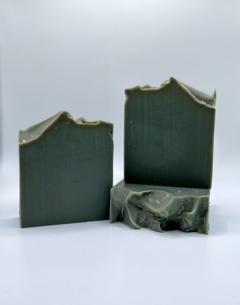 A green soap sitting on top of a counter.