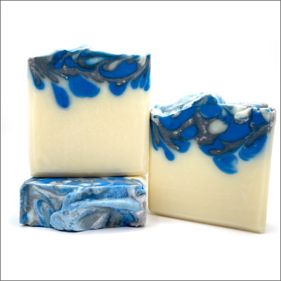 A white and blue soap sitting on top of a table.