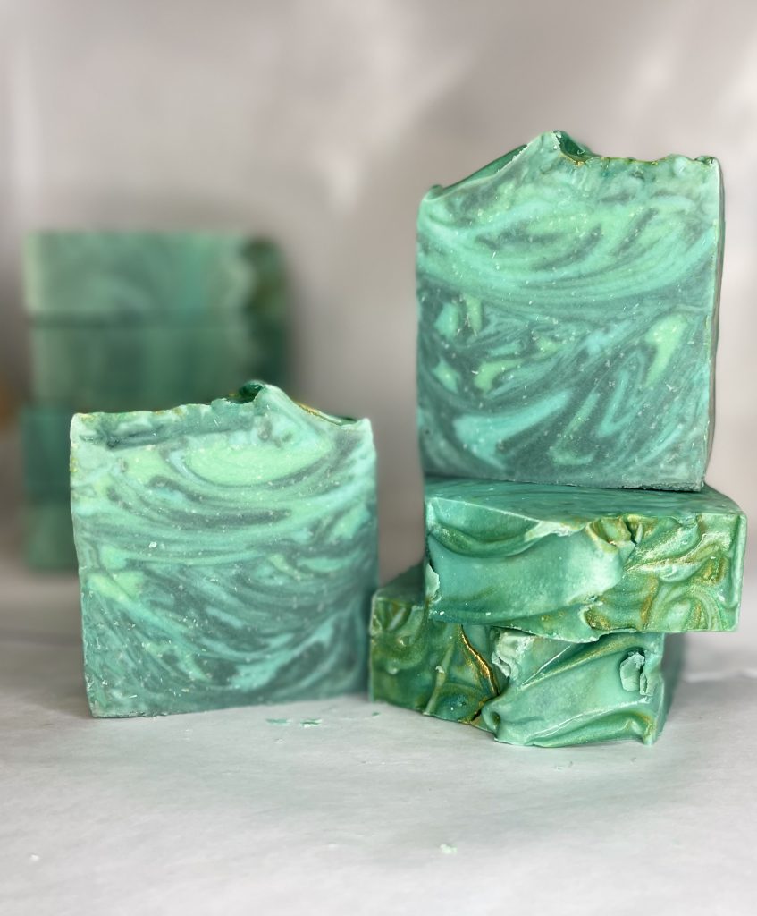 A stack of green soap sitting on top of each other.