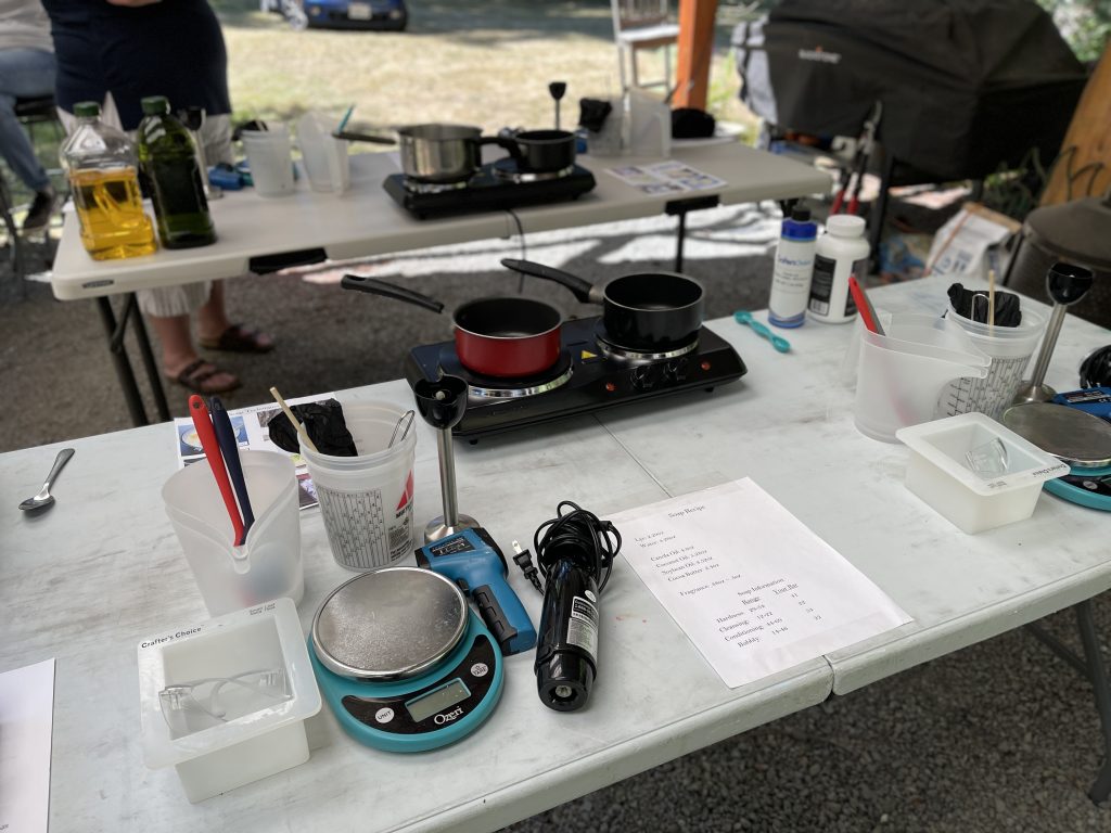 A table with two stoves and a cup on it