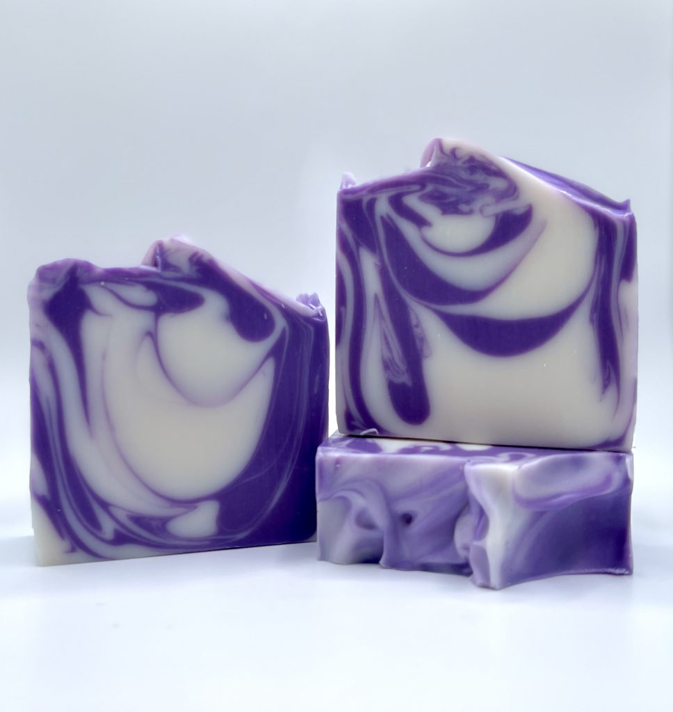 A purple and white soap sitting on top of a table.