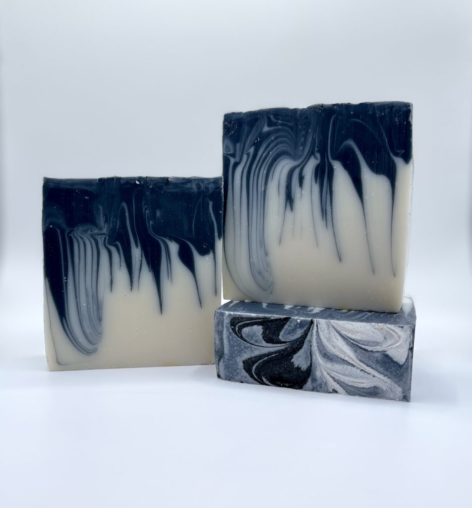 A bar of soap with black and white swirls.