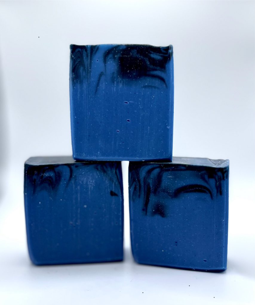 Three blue soap blocks stacked on top of each other.