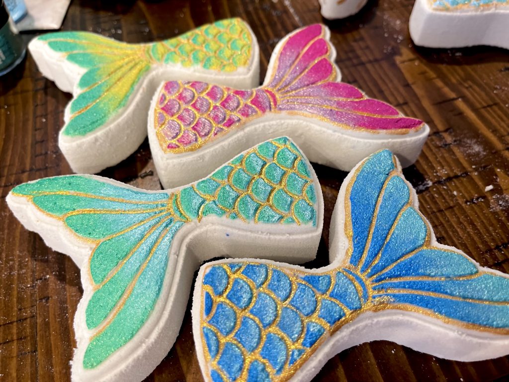 A group of cookies that are shaped like mermaids.