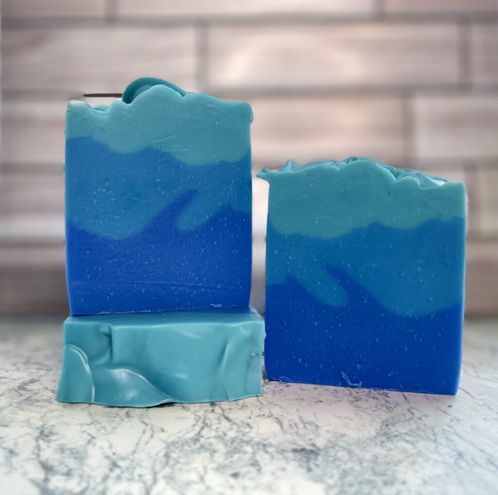 A blue soap sitting on top of a counter.