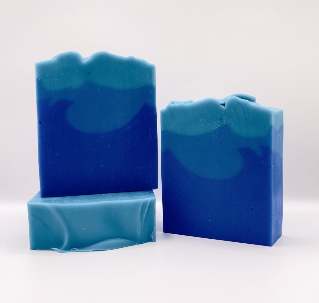 A blue soap sitting on top of a table.