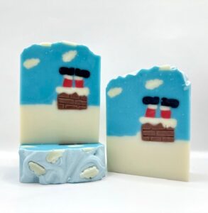 A blue and white soap with two images of a chimney.